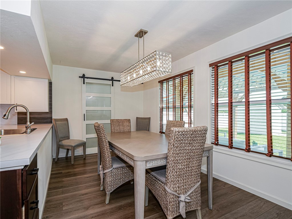 1732 Sunrise Lane Sebastian, FL 32958 - Photo 15 of 36 a view of a dining room with furniture window and wooden floor