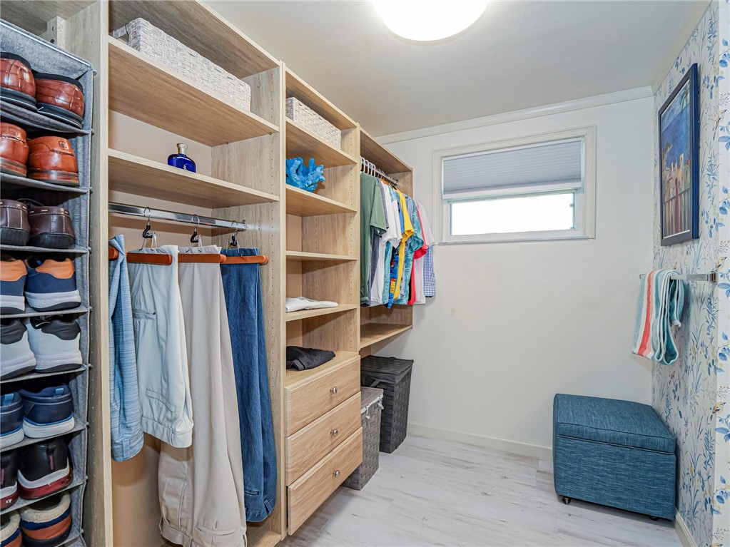 1732 Sunrise Lane Sebastian, FL 32958 - Photo 23 of 36 a view of walk in closet with clothes and shoes