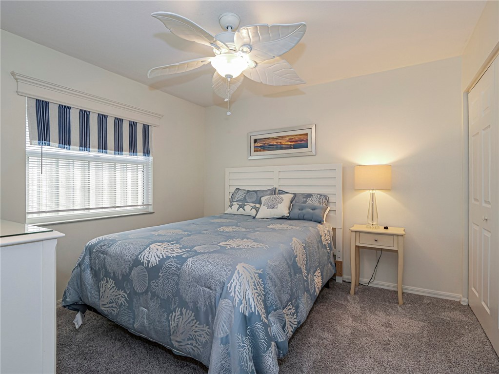 1732 Sunrise Lane Sebastian, FL 32958 - Photo 26 of 36 a bedroom with a bed and a window