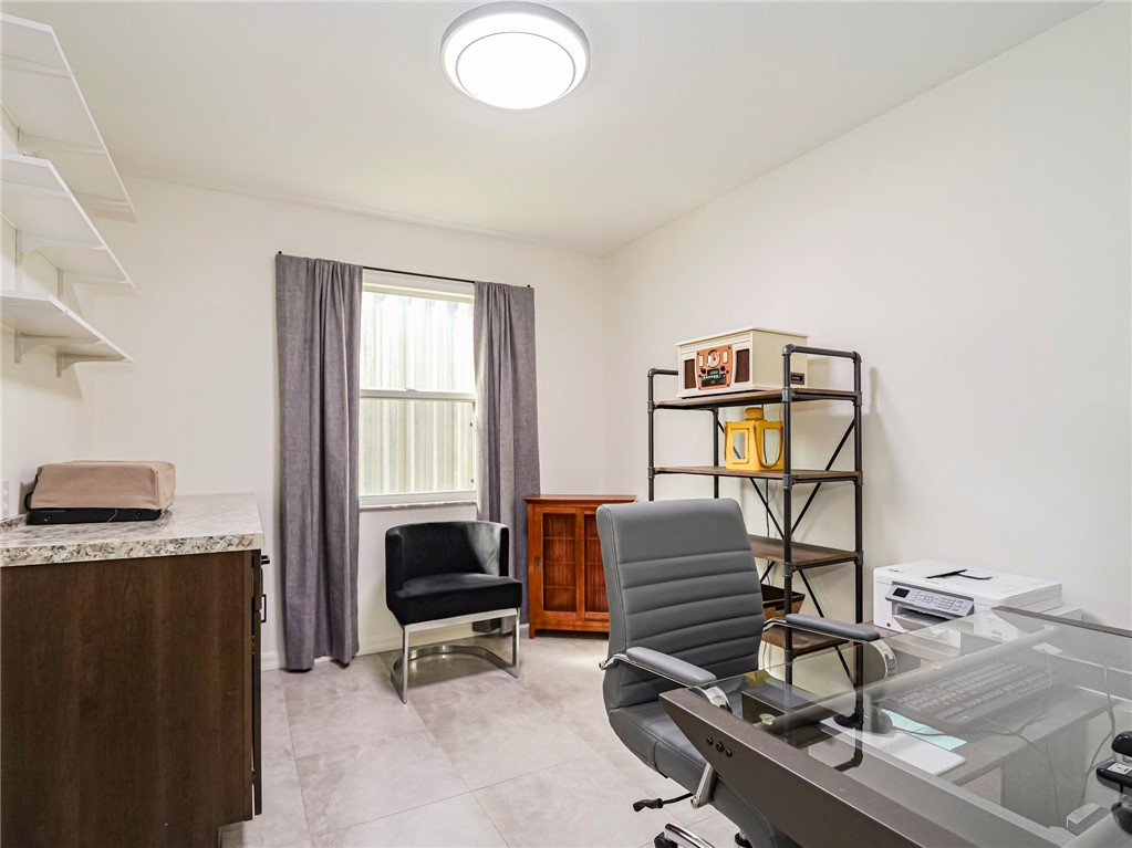 1732 Sunrise Lane Sebastian, FL 32958 - Photo 29 of 36 a view of a workspace with furniture and a window
