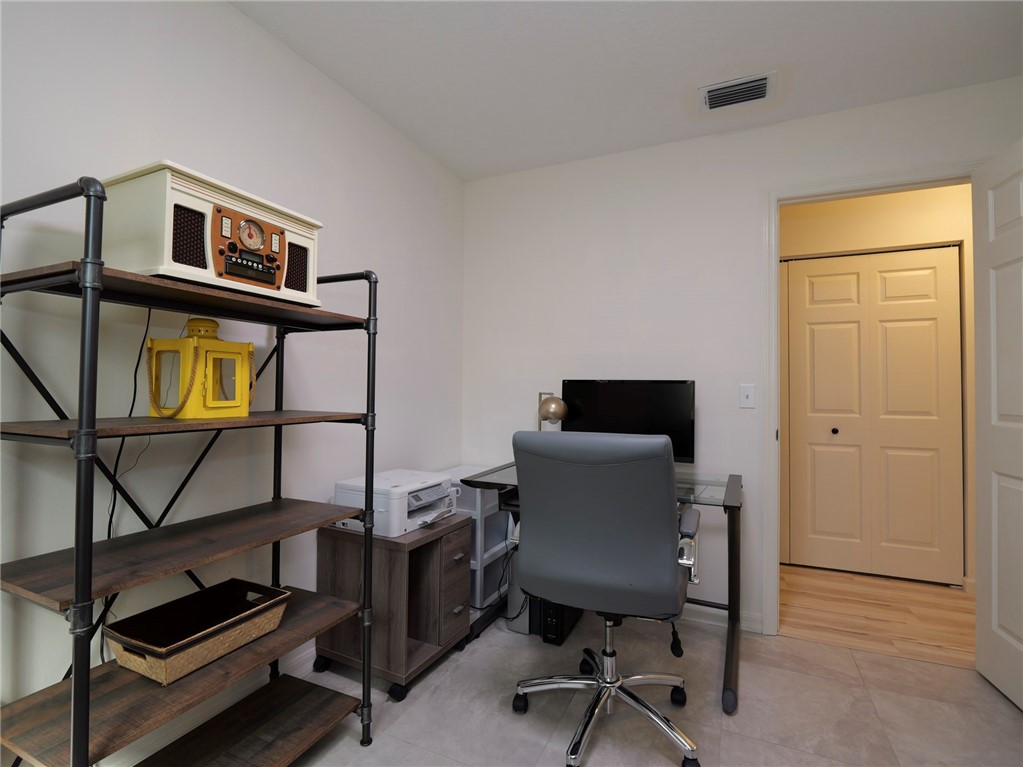 1732 Sunrise Lane Sebastian, FL 32958 - Photo 30 of 36 a view of a workspace with furniture and a window