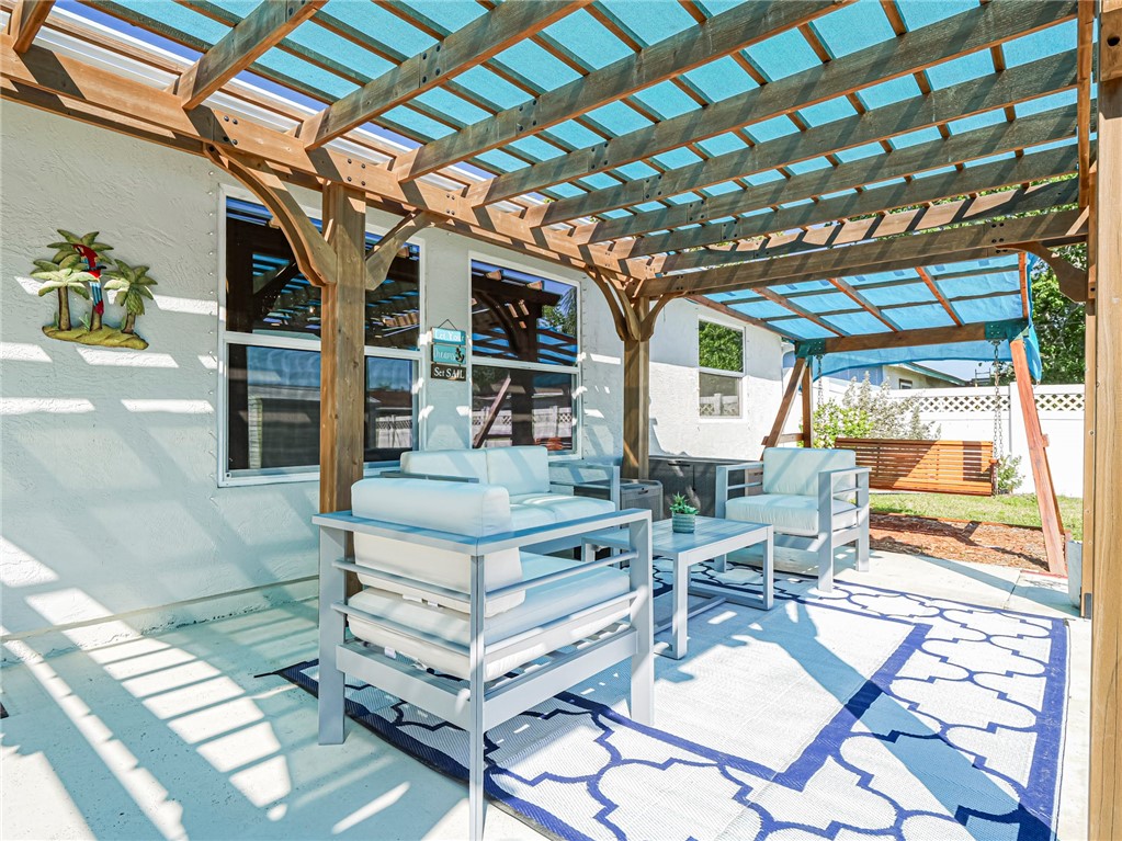 1732 Sunrise Lane Sebastian, FL 32958 - Photo 32 of 36 a view of a chairs and table in the patio