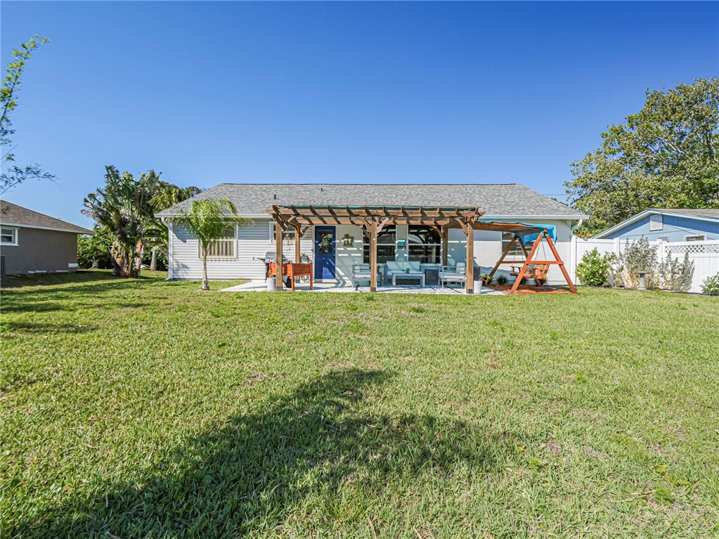 1732 Sunrise Lane Sebastian, FL 32958 - Photo 35 of 36 a view of a house with a big yard
