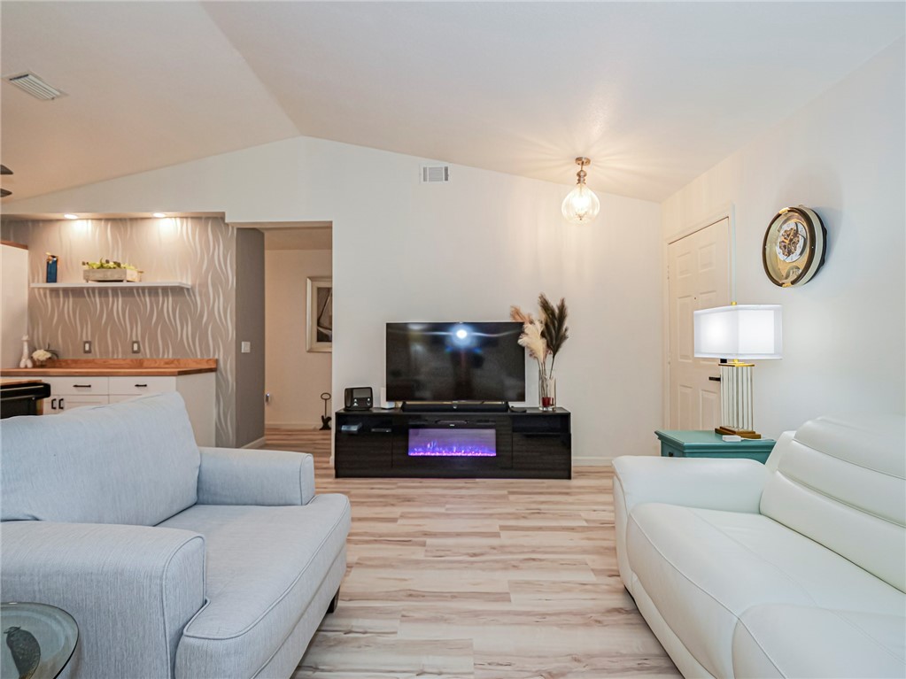 1732 Sunrise Lane Sebastian, FL 32958 - Photo 5 of 36 a living room with furniture and a flat screen tv