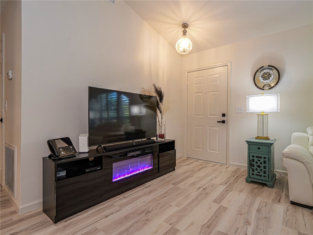 1732 Sunrise Lane Sebastian, FL 32958 - Photo 6 of 36 a living room with furniture and a flat screen tv