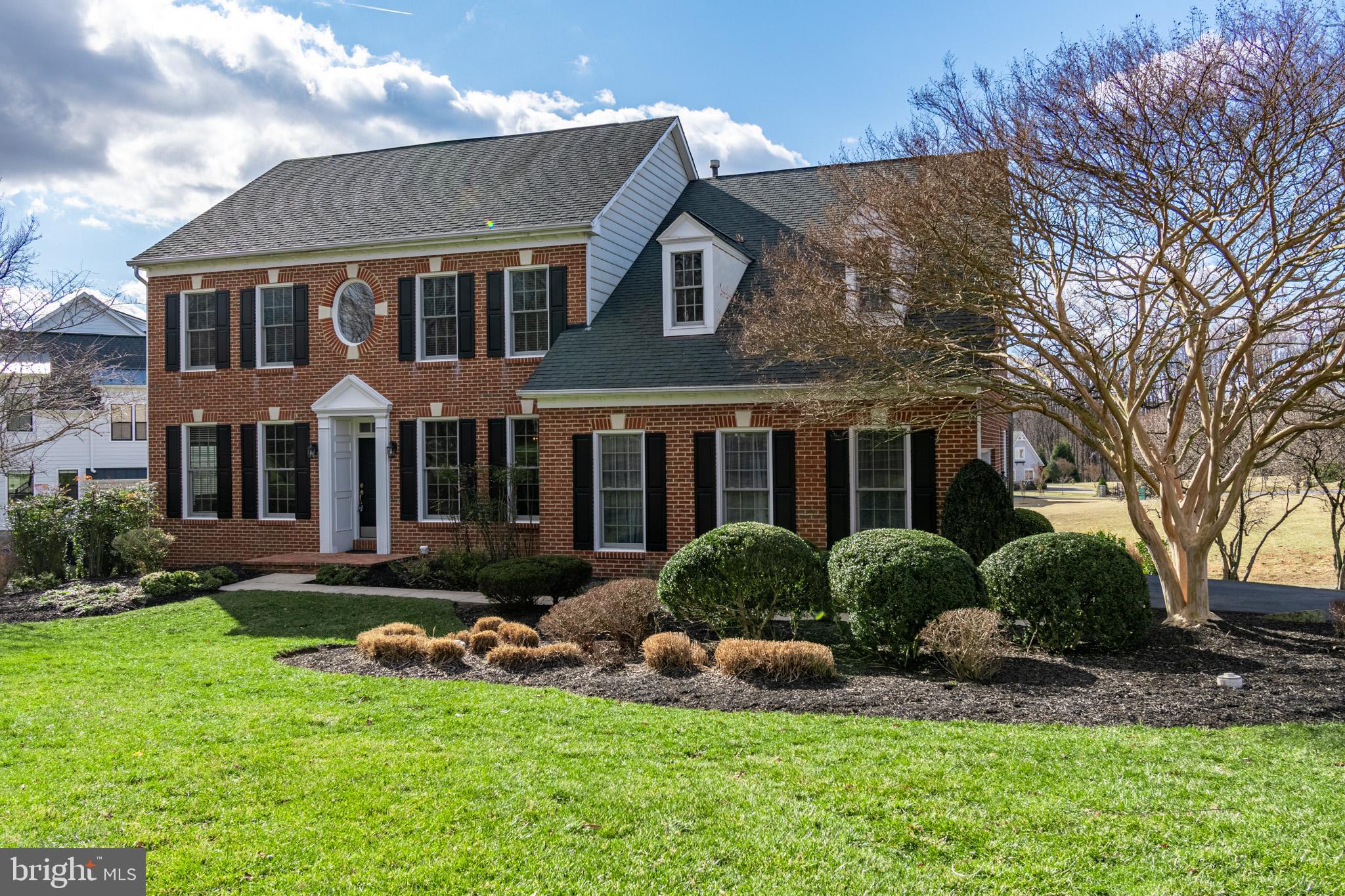 12911 Buckeye Drive North Potomac, MD 20878 - Photo 1 of 74 a front view of a house with a yard and plants