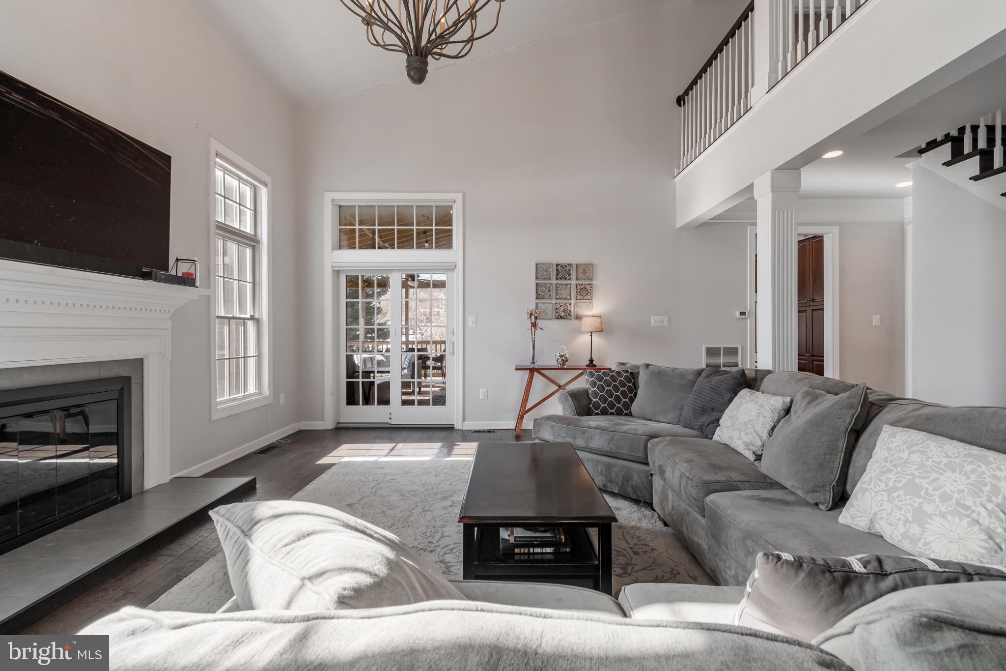 12911 Buckeye Drive North Potomac, MD 20878 - Photo 12 of 74 a living room with furniture or fireplace and a flat screen tv
