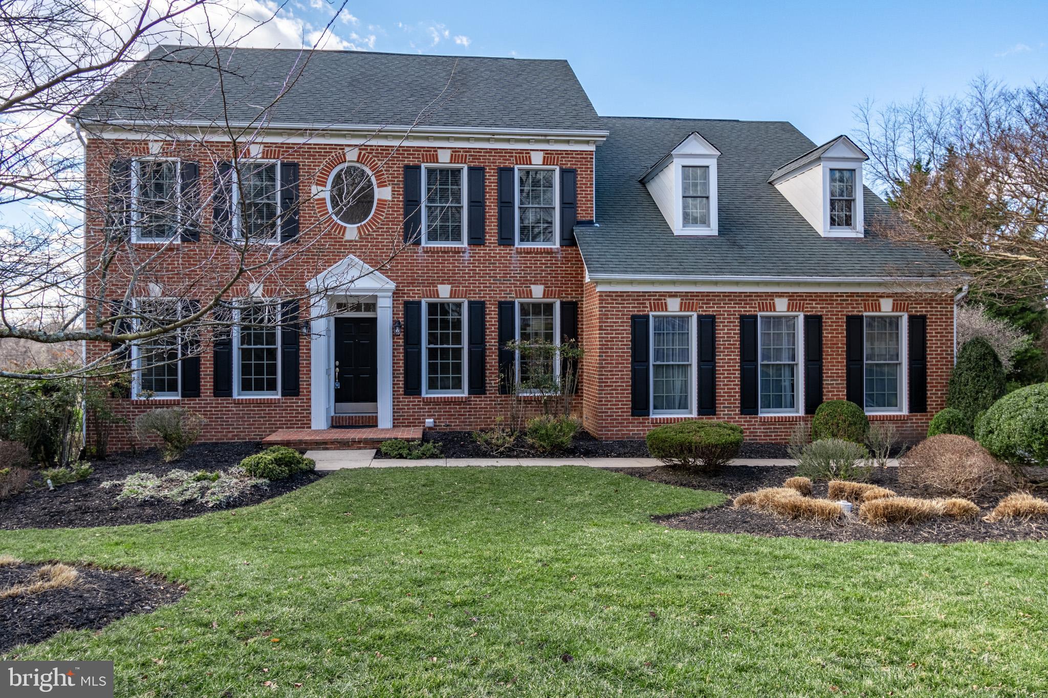 12911 Buckeye Drive North Potomac, MD 20878 - Photo 2 of 74 a front view of a house with a yard and porch