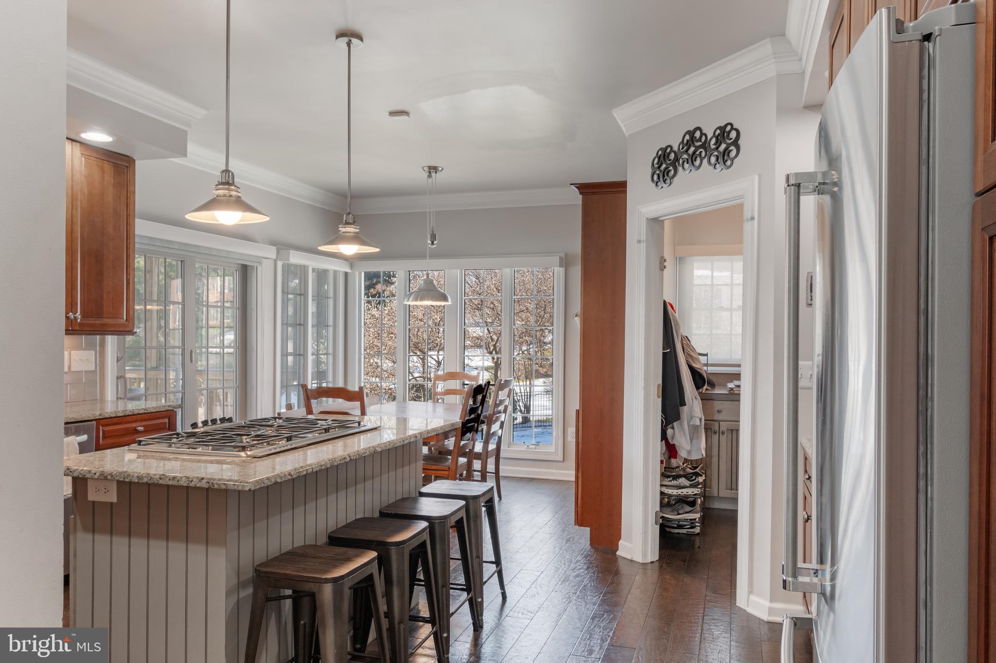 12911 Buckeye Drive North Potomac, MD 20878 - Photo 21 of 74 a view of a dining room and livingroom with furniture wooden floor a chandelier