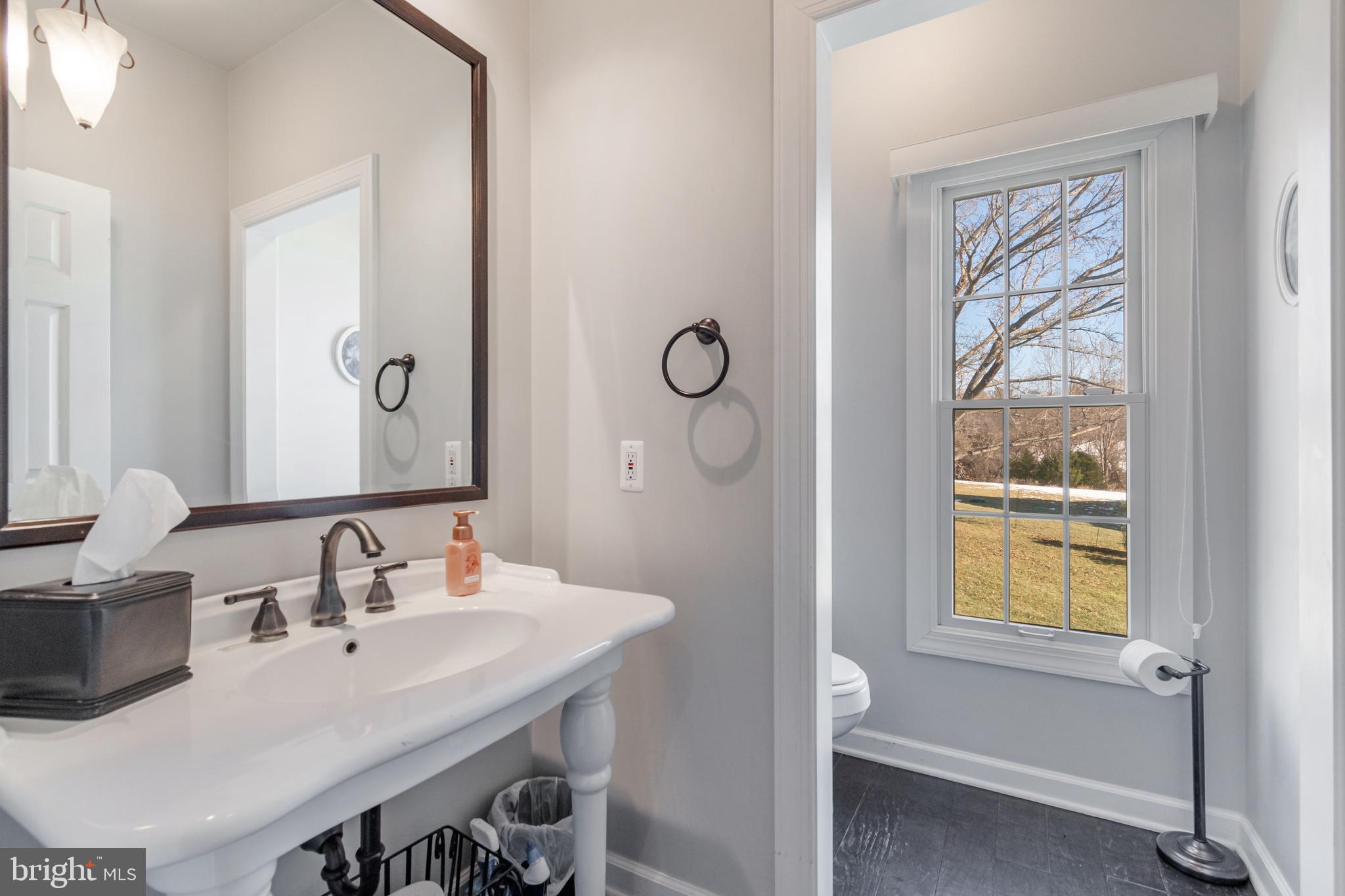 12911 Buckeye Drive North Potomac, MD 20878 - Photo 35 of 74 a bathroom with a sink a mirror and a window