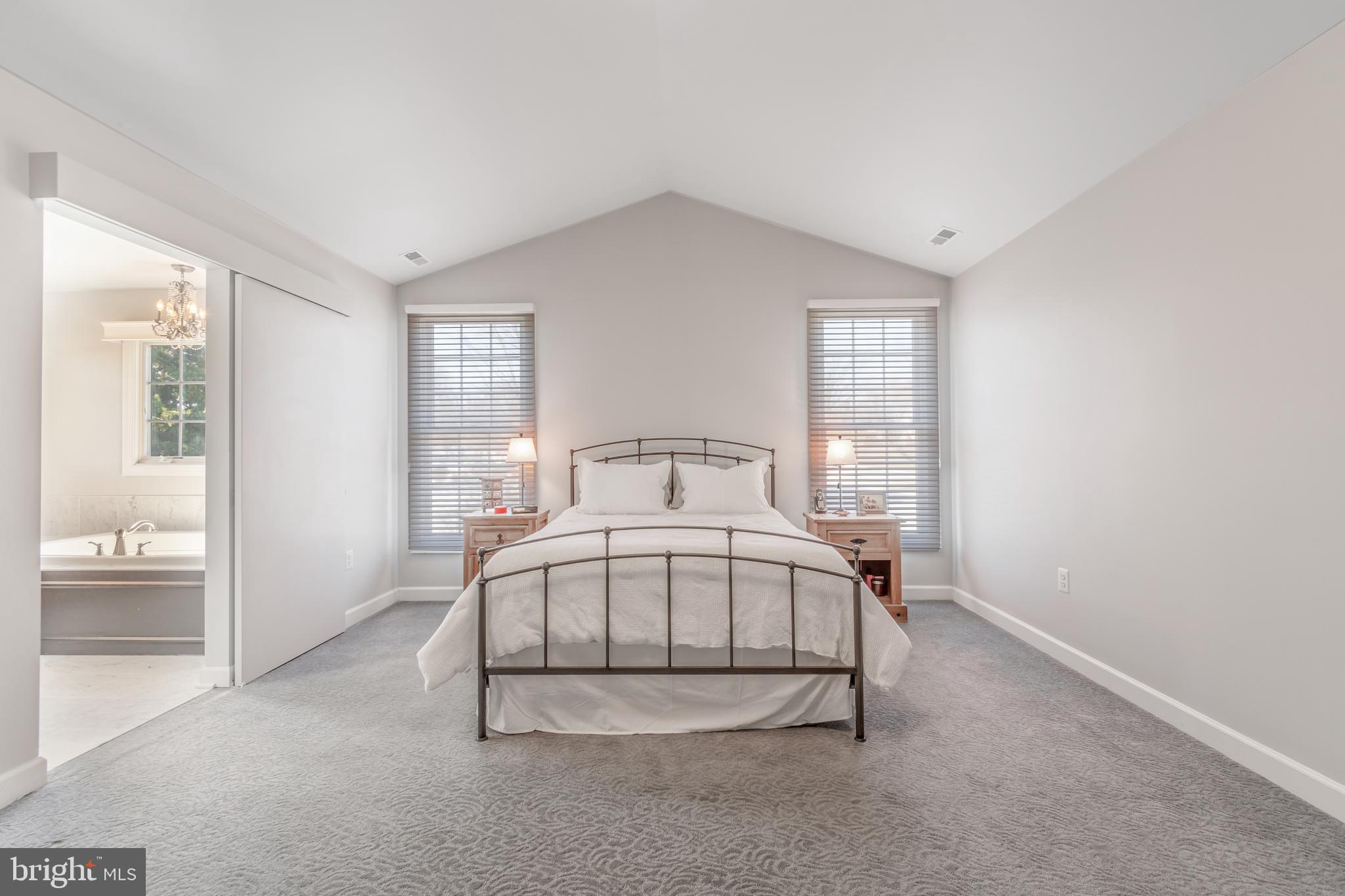 12911 Buckeye Drive North Potomac, MD 20878 - Photo 37 of 74 a white bed sitting in a room next to a window