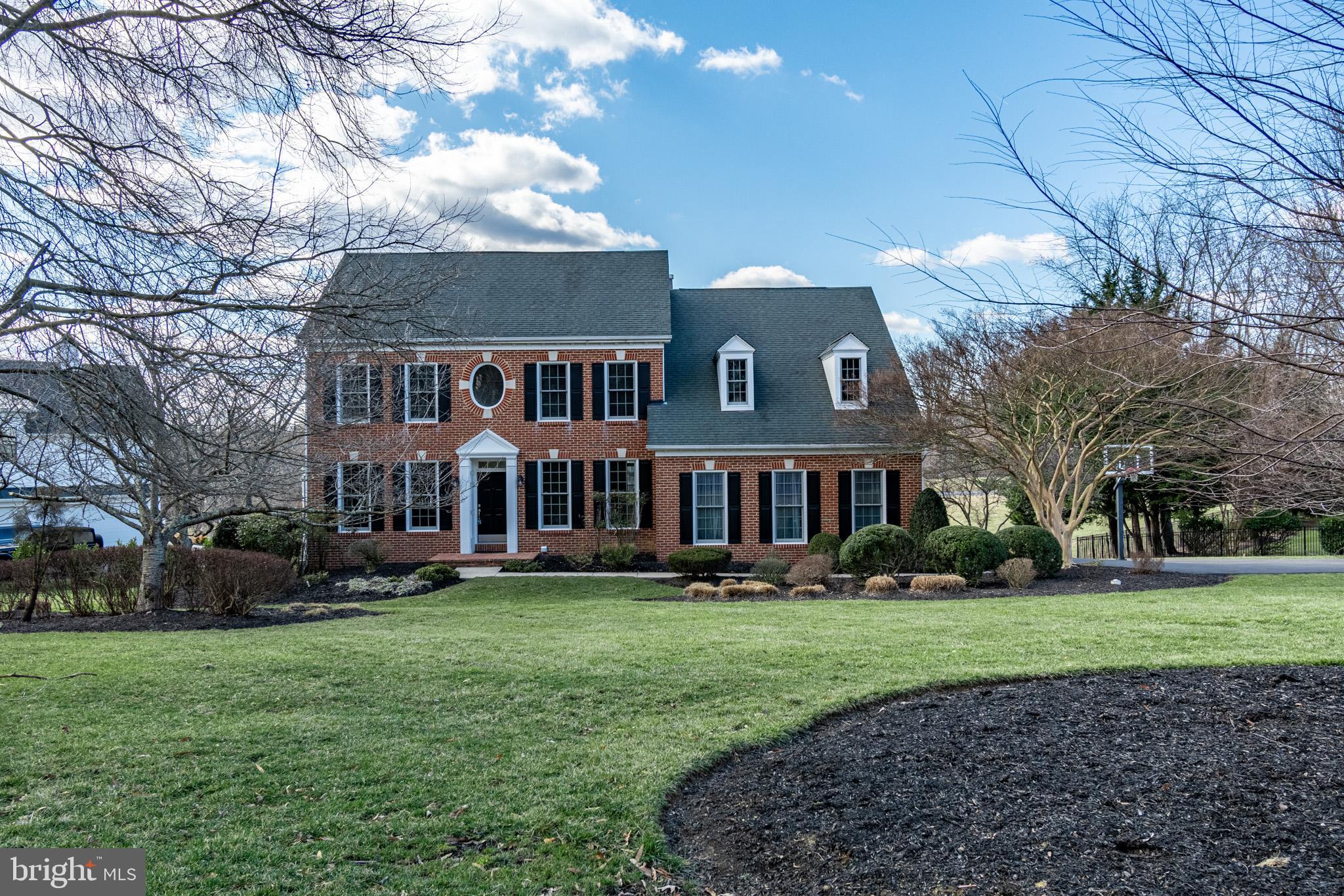 12911 Buckeye Drive North Potomac, MD 20878 - Photo 4 of 74 a front view of house with yard and green space