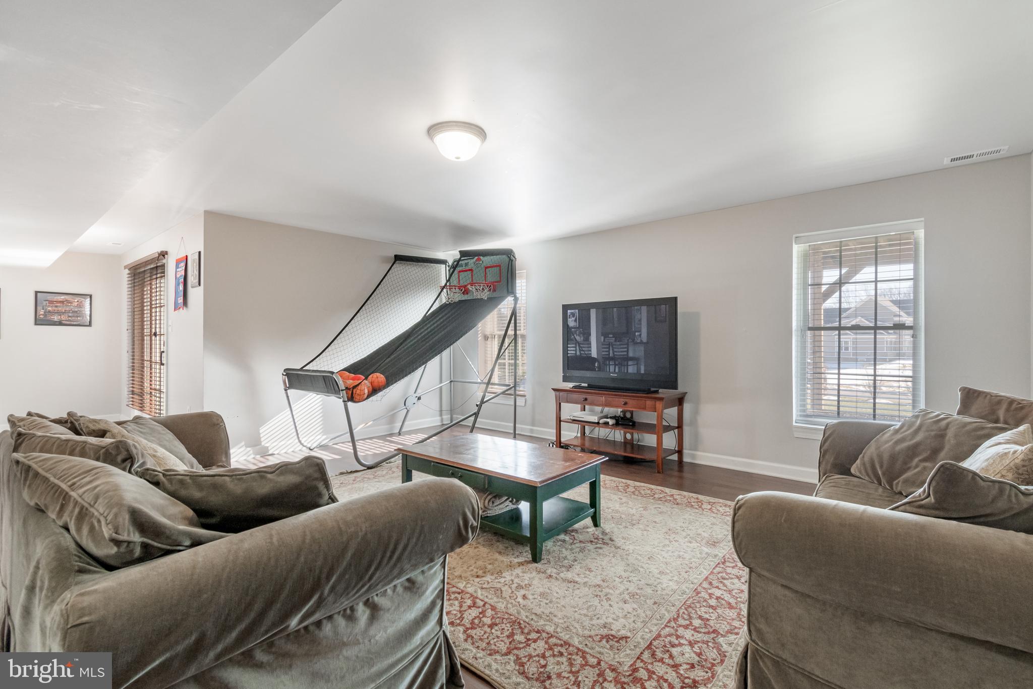 12911 Buckeye Drive North Potomac, MD 20878 - Photo 56 of 74 a living room with furniture and a flat screen tv