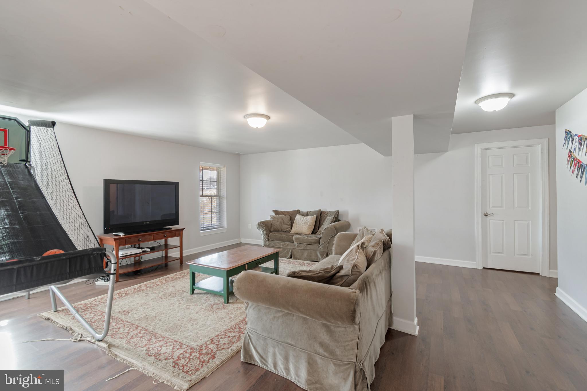 12911 Buckeye Drive North Potomac, MD 20878 - Photo 57 of 74 a living room with furniture and a flat screen tv