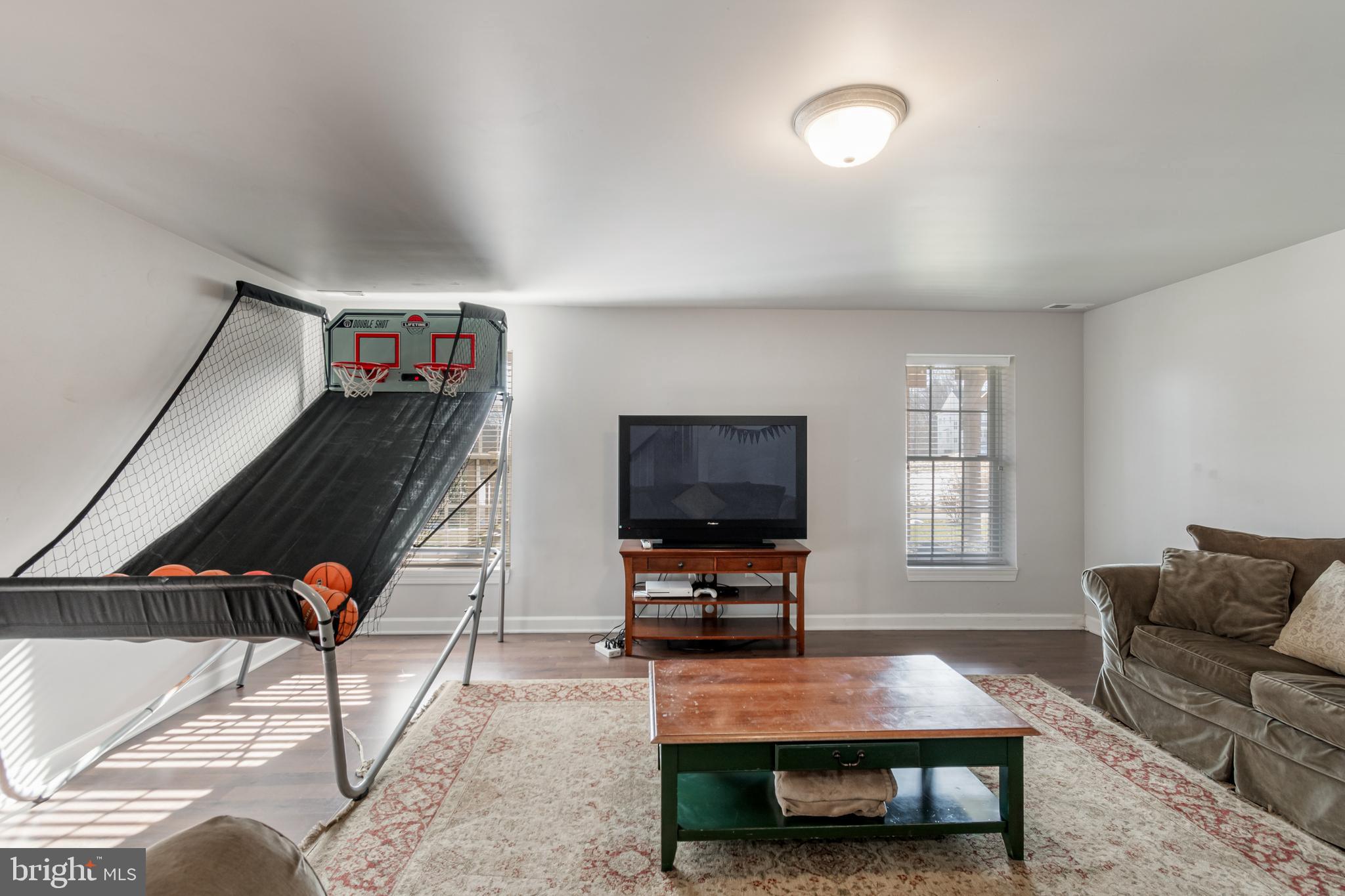 12911 Buckeye Drive North Potomac, MD 20878 - Photo 62 of 74 a living room with furniture and a flat screen tv