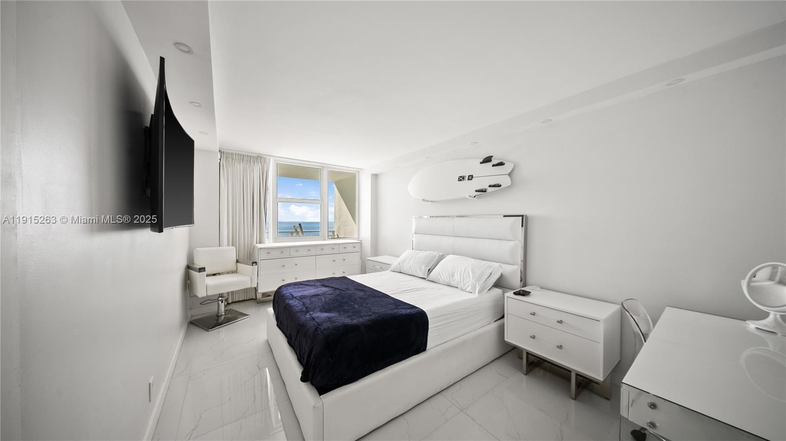 2030 South Ocean Drive, Unit 1716 Hallandale Beach, FL 33009 - Photo 11 of 15 a bedroom with a bed and flat screen tv