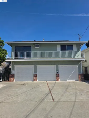 a front view of a house with a garage