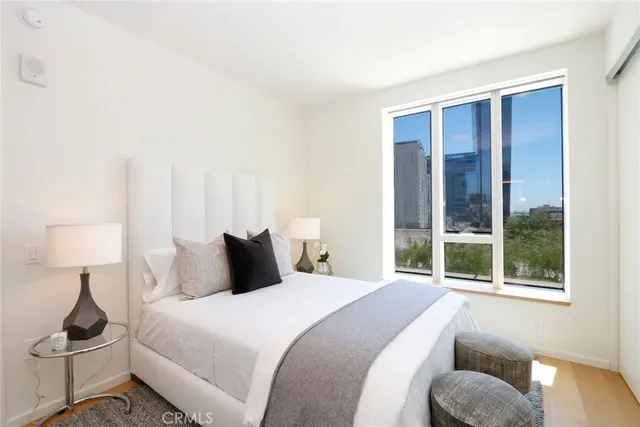 a bedroom with a bed and window