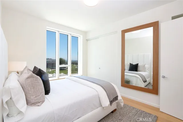 a bedroom with bed and window