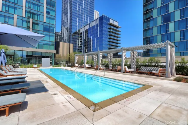 a view of pool with brick walls