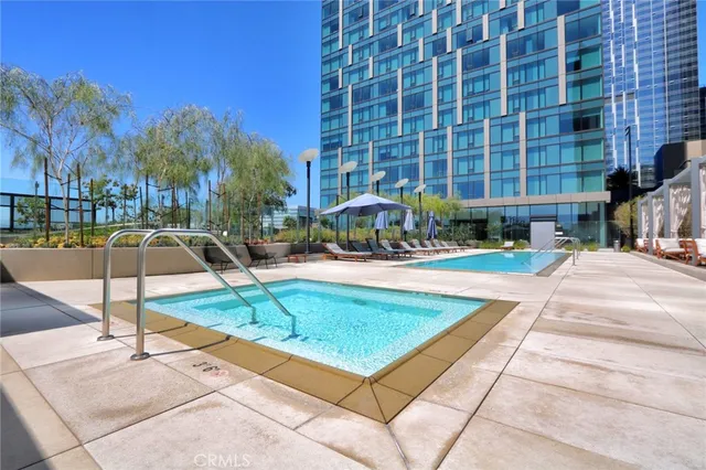 a view of a swimming pool with a lounge chairs