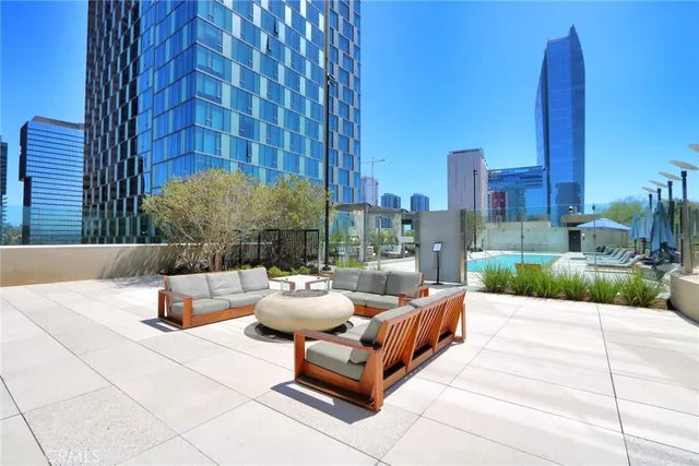 a building outdoor space with patio furniture and a potted plant