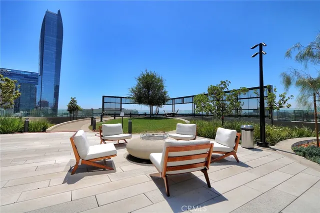 a swimming pool with outdoor seating and yard