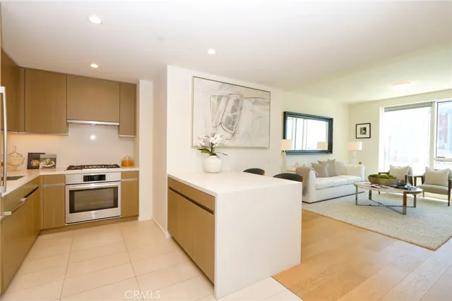 a kitchen with a stove top oven and cabinets
