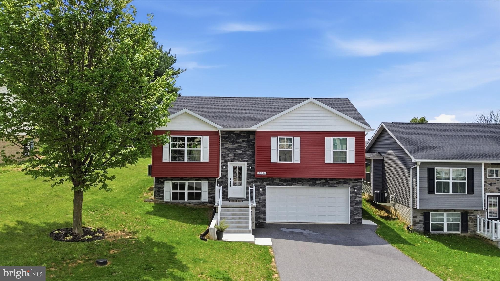 338 Grandview Avenue Waynesboro, PA 17268 - Photo 1 of 40 a front view of a house with a garden and yard