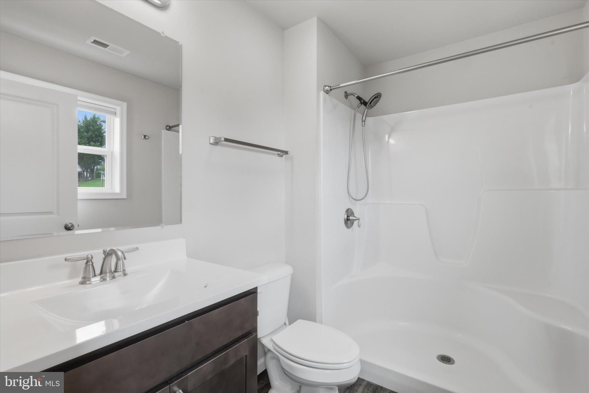 338 Grandview Avenue Waynesboro, PA 17268 - Photo 15 of 40 a bathroom with a sink toilet vanity and shower
