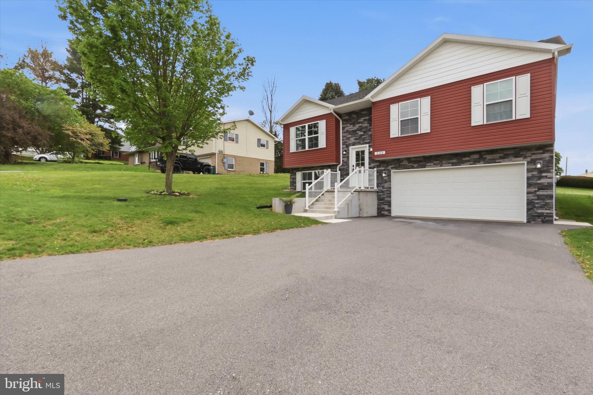 338 Grandview Avenue Waynesboro, PA 17268 - Photo 37 of 40 a front view of a house with a yard and garage