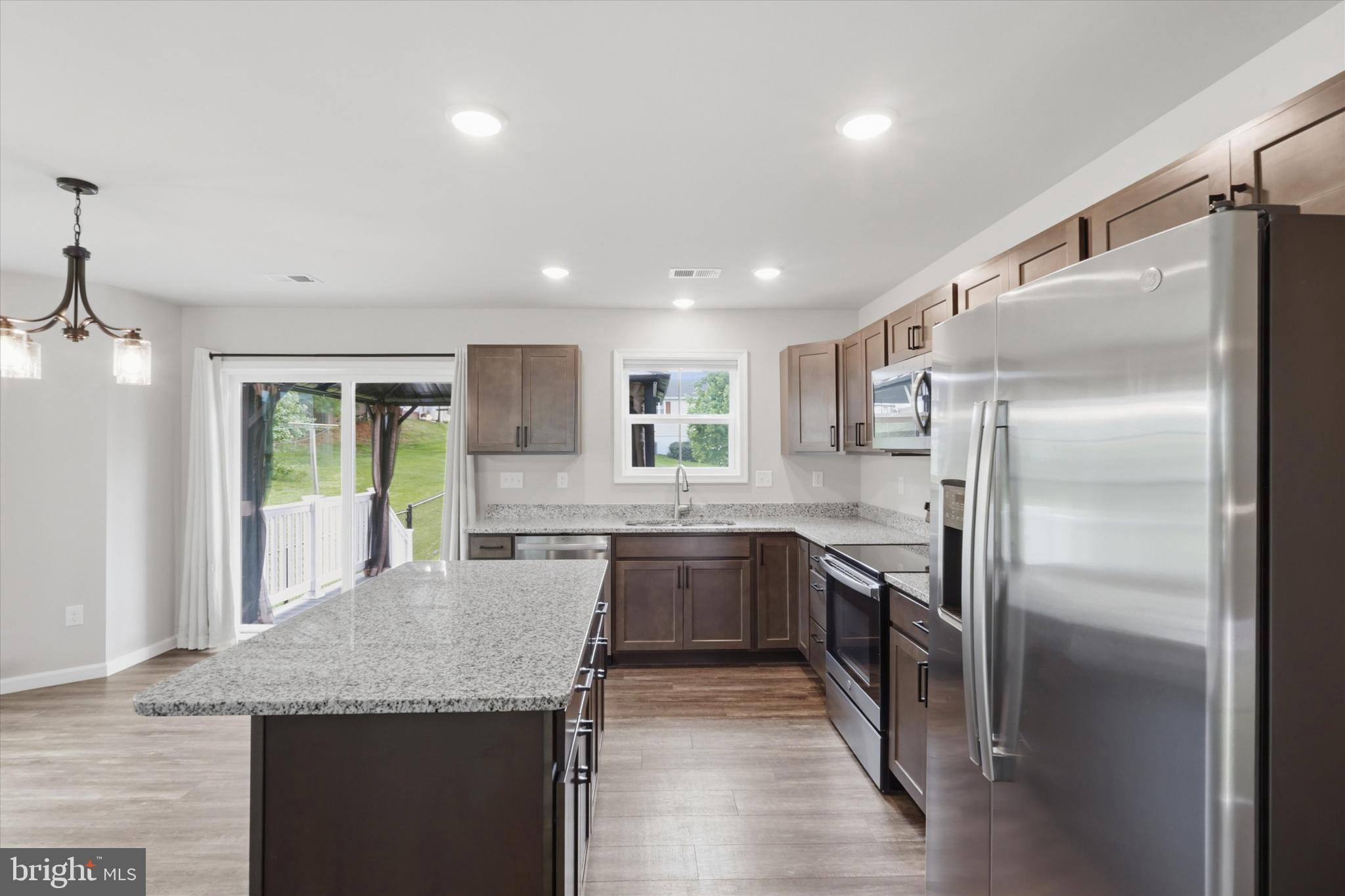 338 Grandview Avenue Waynesboro, PA 17268 - Photo 8 of 40 a kitchen with stainless steel appliances granite countertop a sink refrigerator and cabinets