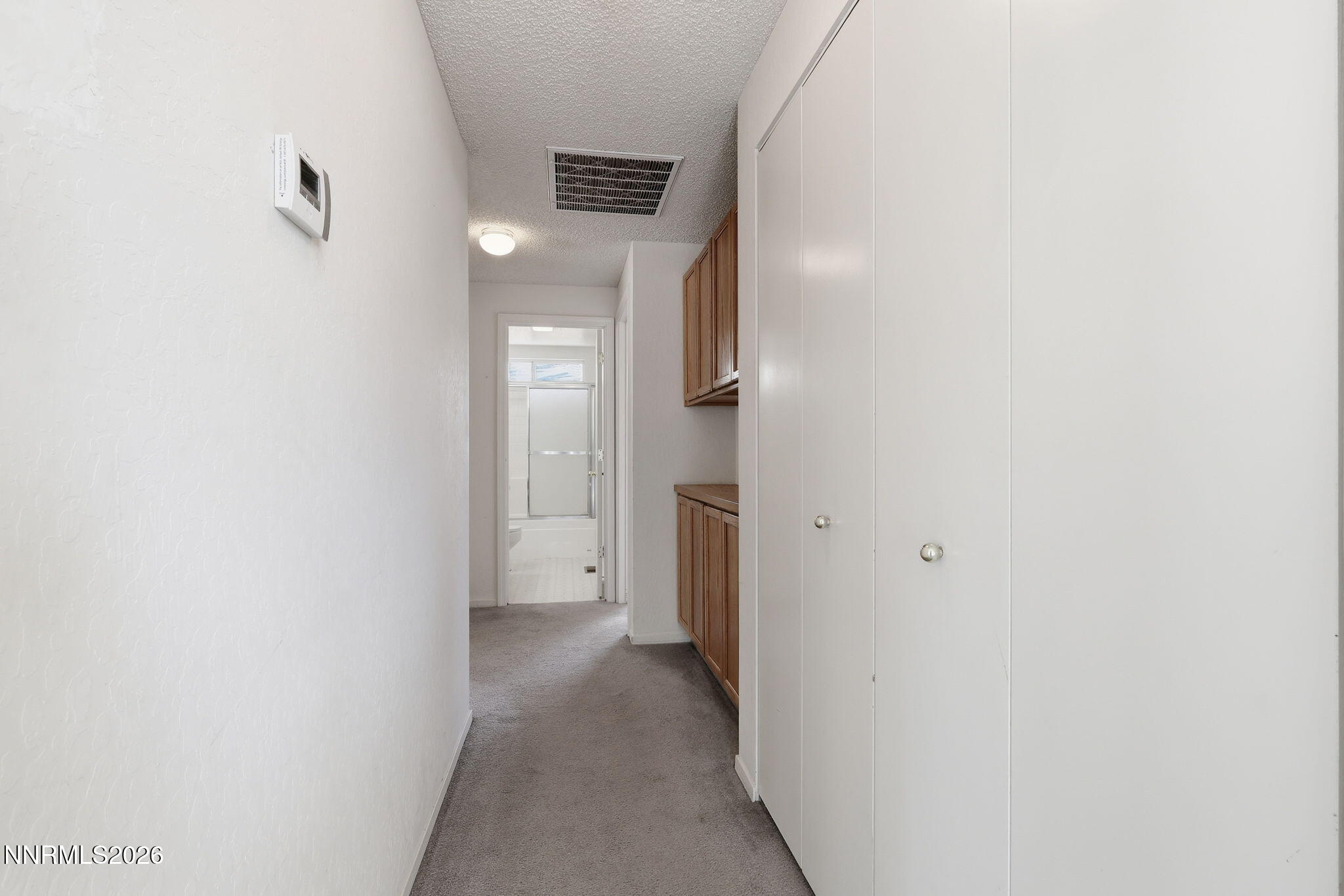 6840 Viscaya Court Reno, NV 89523 - Photo 24 of 25 a view of a hallway with wooden floor