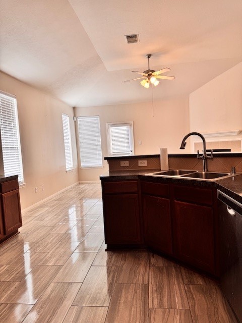 25219 Diamond Ranch Drive Katy, TX 77494 - Photo 2 of 8 a kitchen with a sink a chandelier and wooden floor