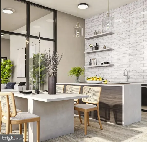 a kitchen with a table and chairs in it