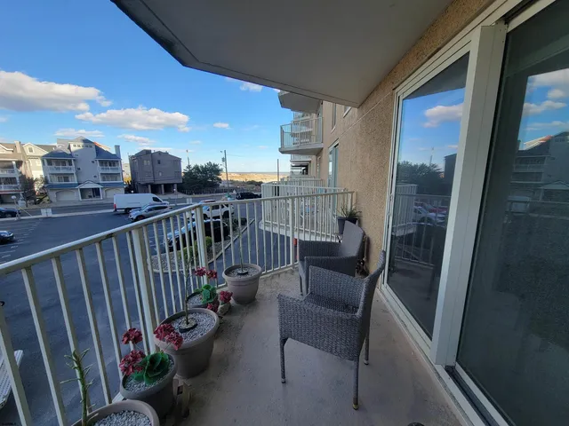 a view of a balcony with chairs