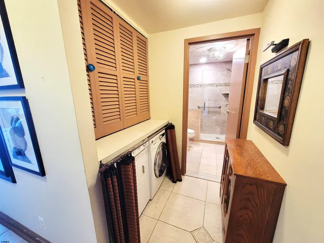 a bathroom with a bathtub sink and mirror