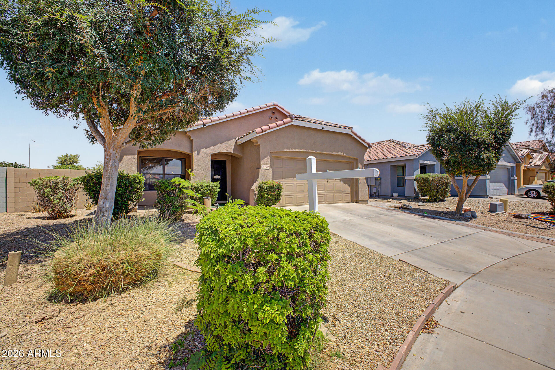 9730 West Payson Road Tolleson, AZ 85353 - Photo 5 of 57 a front view of a house with garden
