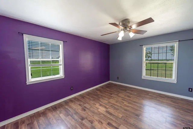 a bathroom with a sink mirror vanity and toilet