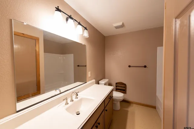 a kitchen with stainless steel appliances a sink dishwasher stove and microwave