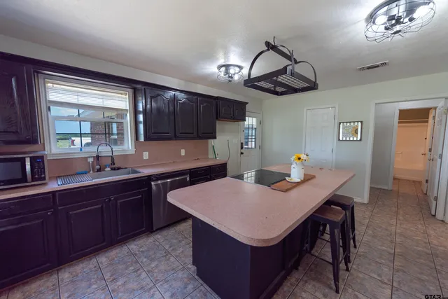 a kitchen with a stove and a table
