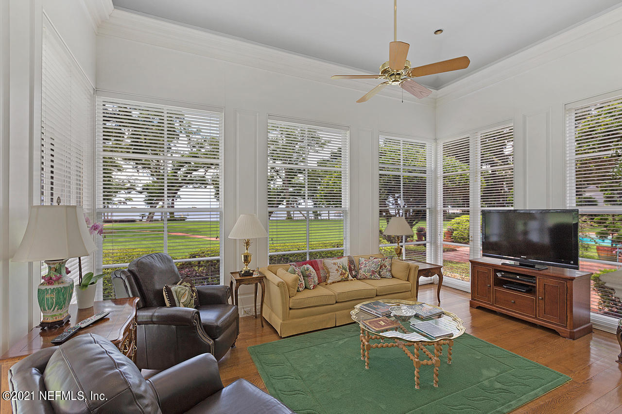 2180 Eventide Avenue St. Johns, FL 32259 - Photo 17 of 91 a living room with furniture a flat screen tv and a floor to ceiling window