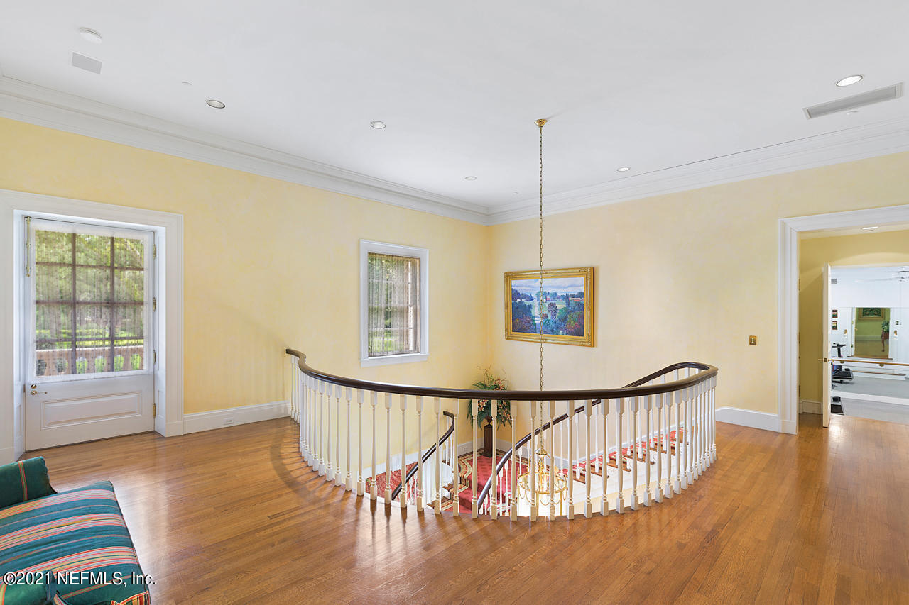 2180 Eventide Avenue St. Johns, FL 32259 - Photo 19 of 91 a view of a hallway to room with wooden floor and windows