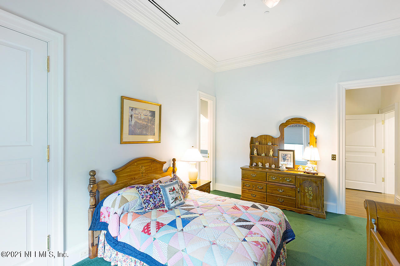 2180 Eventide Avenue St. Johns, FL 32259 - Photo 27 of 91 a bedroom with a bed and a lamp on dresser