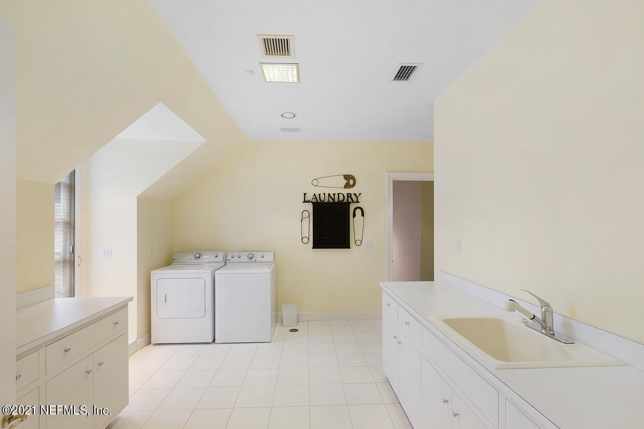 2180 Eventide Avenue St. Johns, FL 32259 - Photo 44 of 91 a bathroom with a tub sink and mirror