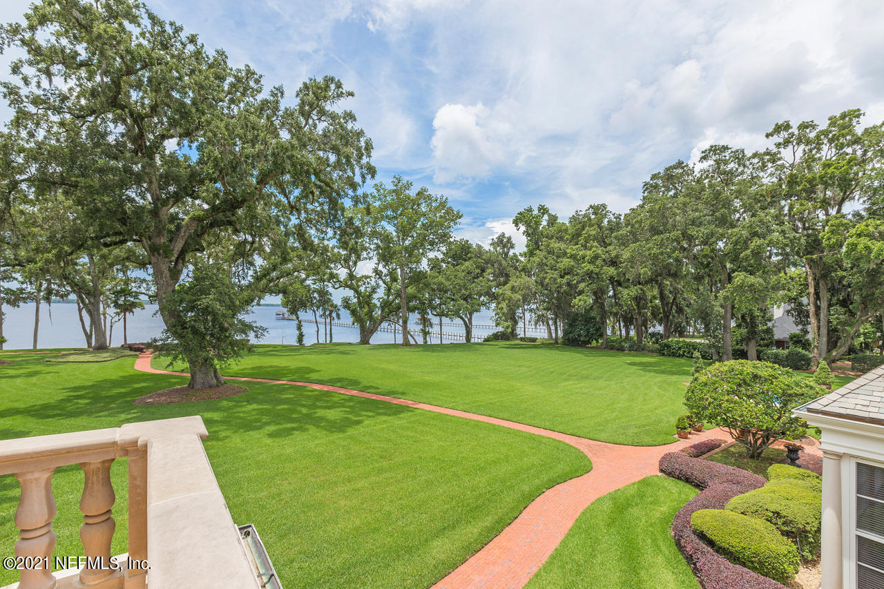 2180 Eventide Avenue St. Johns, FL 32259 - Photo 60 of 91 a view of a park with trees and a wooden fence