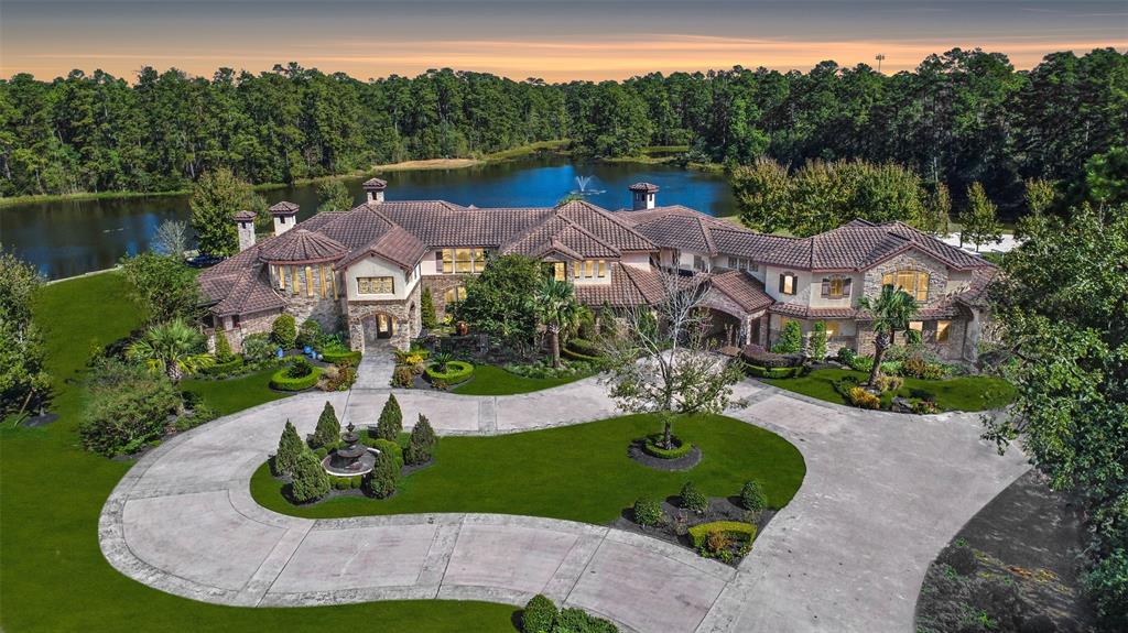 27918 Hansons Court Spring, TX 77386 - Photo 1 of 49 an aerial view of a house with outdoor space and lake view
