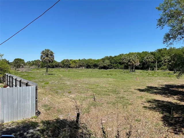 a view of a lake with a yard