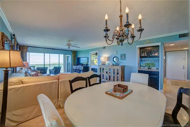 a kitchen with a table and chairs in it