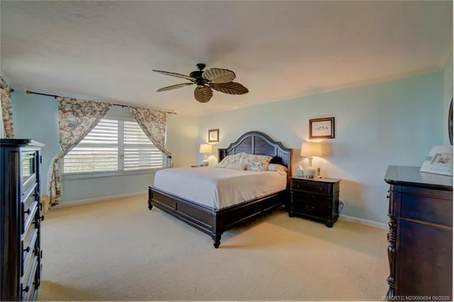 a bedroom with a bed and a television